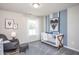 Bedroom room with crib and a gray rocking chair at 3404 Pelican Ln, Durham, NC 27703