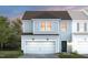 Charming two-story home featuring an attached garage, gray siding, and a well-maintained front yard at 3404 Pelican Ln, Durham, NC 27703