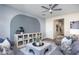 Cozy living room featuring an accent wall, built-in shelving, and seamlessly connects to other living spaces at 3404 Pelican Ln, Durham, NC 27703