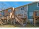 Exterior of the back of three townhouses with wooden decks and stairs at 3622 Colchester St # 13, Durham, NC 27707