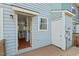 Open back door of the unit leads to hardwood floors and a view of built-in shelves at 3622 Colchester St # 13, Durham, NC 27707