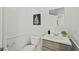 Cozy powder room featuring a classic vanity, toilet, and stylish decor for guests' convenience at 3622 Colchester St # 13, Durham, NC 27707