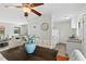 Bright dining area with a dark wood table complemented by upholstered chairs and an overhead ceiling fan at 3622 Colchester St # 13, Durham, NC 27707