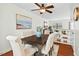 Well-lit dining area with a stylish table, upholstered chairs, and hardwood floors at 3622 Colchester St # 13, Durham, NC 27707