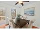 Inviting dining area boasting a classic table with cozy chairs, wood flooring, and natural light at 3622 Colchester St # 13, Durham, NC 27707
