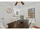 Bright dining area with modern table and chairs, complemented by a lovely vase of flowers at 3622 Colchester St # 13, Durham, NC 27707