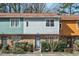 Front exterior of townhouse with stone accents and colorful siding at 3622 Colchester St # 13, Durham, NC 27707