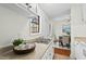 Well-lit kitchen showcasing ample counter space, white appliances, and an open view of the dining area at 3622 Colchester St # 13, Durham, NC 27707