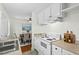 Well-designed kitchen overlooking the dining area, equipped with white appliances and sufficient counter space at 3622 Colchester St # 13, Durham, NC 27707