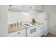 Bright kitchen featuring white appliances, laminate countertops, and sufficient storage, perfect for daily cooking at 3622 Colchester St # 13, Durham, NC 27707