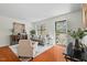 Well-lit living room featuring wood floors, contemporary furnishings, and a view of the exterior at 3622 Colchester St # 13, Durham, NC 27707