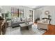 Stylishly decorated living room with hardwood floors, a comfortable sofa, and ample lighting at 3622 Colchester St # 13, Durham, NC 27707
