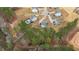 Aerial view of a residential neighborhood showcasing tree-lined streets and well-maintained homes at 40 Long Needle Ct, Youngsville, NC 27596