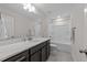 Bright bathroom featuring a modern vanity, white countertop, and shower-tub combination at 40 Long Needle Ct, Youngsville, NC 27596