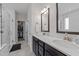 Bathroom features double vanity sinks, tiled floors, and a glass door shower at 40 Long Needle Ct, Youngsville, NC 27596