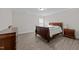 Bedroom with light gray flooring, a queen-size bed, and natural light from the window at 40 Long Needle Ct, Youngsville, NC 27596