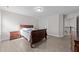 Bedroom with light gray floors and a view of the upstairs hallway at 40 Long Needle Ct, Youngsville, NC 27596