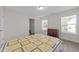 Comfortable bedroom featuring a quilt, dresser, and natural lighting at 40 Long Needle Ct, Youngsville, NC 27596