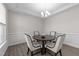 Bright dining room features a round table, stylish chairs, elegant lighting, and decorative trim at 40 Long Needle Ct, Youngsville, NC 27596