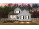 Charming two-story home with a welcoming front porch and well-manicured landscaping at 40 Long Needle Ct, Youngsville, NC 27596