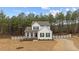 Charming two-story home with a well-manicured lawn and a classic white picket fence at 40 Long Needle Ct, Youngsville, NC 27596