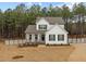 Beautiful two-story home with a classic design, surrounded by a well-maintained lawn and mature trees at 40 Long Needle Ct, Youngsville, NC 27596