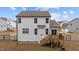 The back of the home shows a wooden deck, nice yard and white vinyl fencing at 40 Long Needle Ct, Youngsville, NC 27596