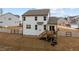 The back of the home shows a wooden deck, nice yard and white vinyl fencing at 40 Long Needle Ct, Youngsville, NC 27596