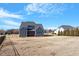 Spacious backyard with a covered patio and well-maintained lawn, great for outdoor activities at 4009 Banks Stone Dr, Raleigh, NC 27603