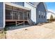 Beautiful backyard with a screened-in porch, patio, and well-maintained lawn at 4009 Banks Stone Dr, Raleigh, NC 27603