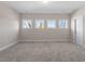 Bedroom with large windows and carpet at 4009 Banks Stone Dr, Raleigh, NC 27603