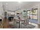 Dining area with view of kitchen, living space, and outdoor deck at 4009 Banks Stone Dr, Raleigh, NC 27603
