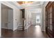 Spacious foyer boasts hardwood floors, stairs and decorative wall accents with large windows at 4009 Banks Stone Dr, Raleigh, NC 27603