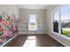 Bright home office with custom built-in shelves and large windows for plenty of natural light at 4009 Banks Stone Dr, Raleigh, NC 27603