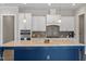 Spacious kitchen with stainless steel appliances, kitchen island and stylish backsplash at 4009 Banks Stone Dr, Raleigh, NC 27603