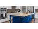 Island with granite countertops, stainless steel appliances, and a modern faucet at 4009 Banks Stone Dr, Raleigh, NC 27603
