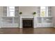 Bright living room boasts a fireplace, built-ins and floods of natural light at 4009 Banks Stone Dr, Raleigh, NC 27603