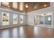 Spacious living room featuring wood floors, natural light, and sliding glass doors leading to the outdoors at 4009 Banks Stone Dr, Raleigh, NC 27603