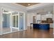 View from living room featuring wood floors, natural light, and a stylish island kitchen at 4009 Banks Stone Dr, Raleigh, NC 27603