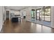 Open layout showcasing kitchen, living area, and deck access through sliding glass doors at 4009 Banks Stone Dr, Raleigh, NC 27603