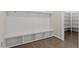 Mudroom with built-in bench, storage cubbies, coat hooks, and hardwood floors at 4009 Banks Stone Dr, Raleigh, NC 27603