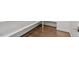 Pantry with built-in white shelving and hardwood floors at 4009 Banks Stone Dr, Raleigh, NC 27603