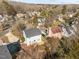 Aerial view of a neighborhood featuring houses with decks and mature trees at 4319 White Cliff Ln, Durham, NC 27712