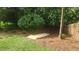 A backyard with an exposed wooded area and small wooden steps at 4319 White Cliff Ln, Durham, NC 27712