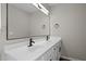 Bathroom featuring double sinks, large mirrors, and modern matte-black hardware at 4319 White Cliff Ln, Durham, NC 27712