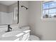 Bathroom with a large mirror, white vanity, and bright natural light at 4319 White Cliff Ln, Durham, NC 27712