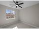 Bedroom with neutral walls, carpet, a ceiling fan, and a window with a view at 4319 White Cliff Ln, Durham, NC 27712