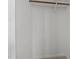 Clean, open closet space with a wooden hanging bar ready for ample storage at 4319 White Cliff Ln, Durham, NC 27712