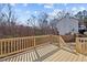New wooden deck overlooking the backyard with a railing and stairs at 4319 White Cliff Ln, Durham, NC 27712