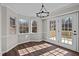 Dining area with windows and french doors that flood the room with natural light at 4319 White Cliff Ln, Durham, NC 27712